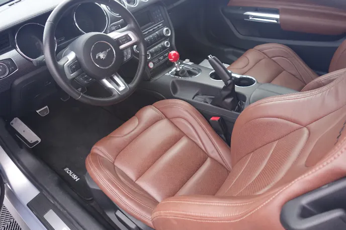 The latest P-51 features bomber-jacket style leather seats and door panel accents.