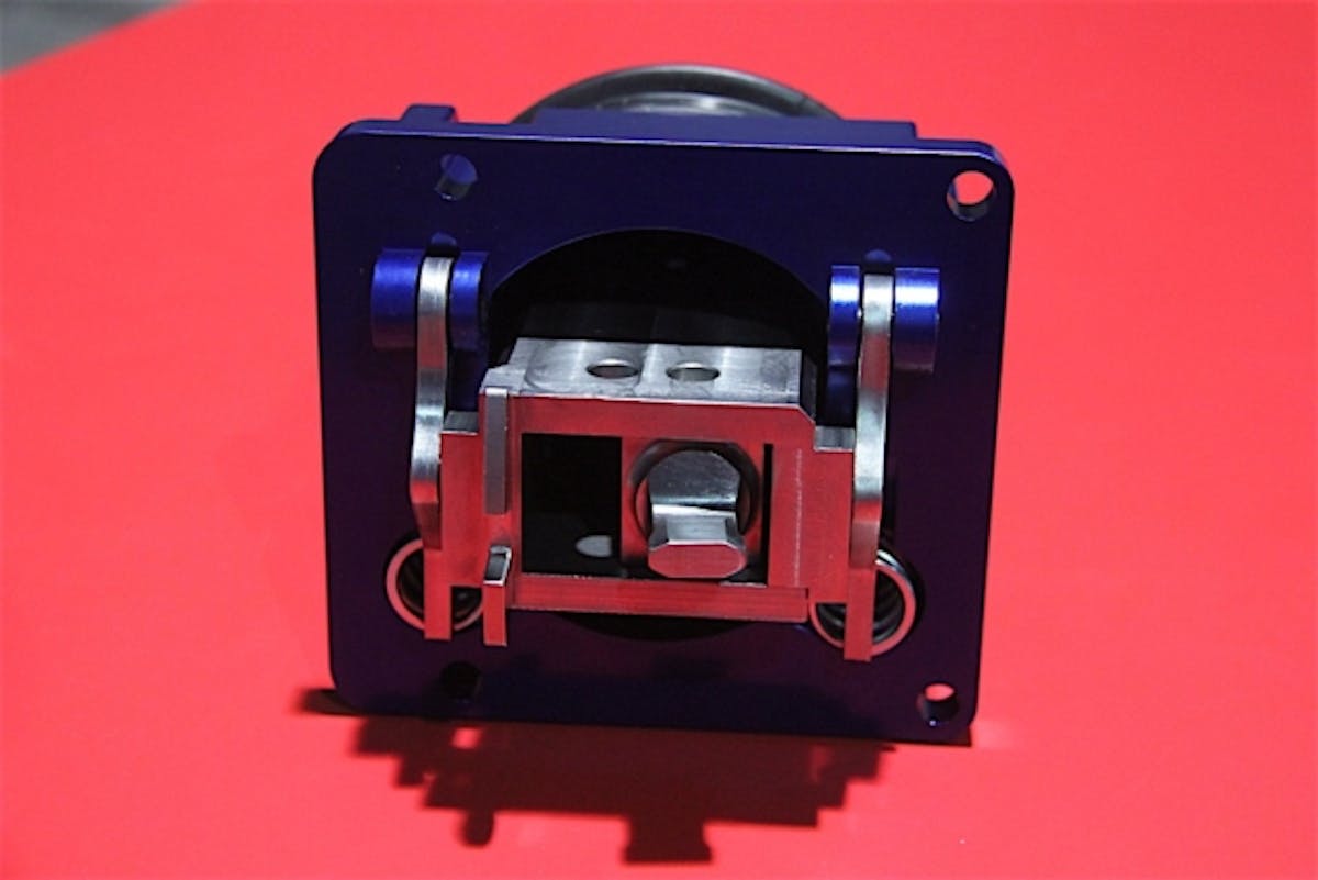 The shifter is comprised of 303 stainless steel for the stick, a CNC-machined aluminum base, and a spherical glass-filled nylon pivot ball.