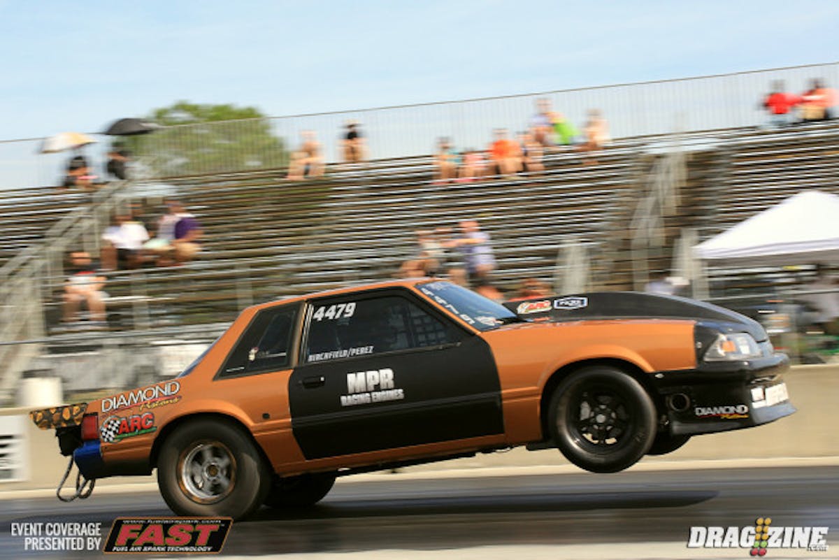 We are rockin and rolling here in Orlando thisafternoon with qualifying set to run at four, we are just waiting for the cars testing to run out the lanes. Here Ari Birchfield rides out a wheelie in Enrique Perez' Ultra Street Mustang.