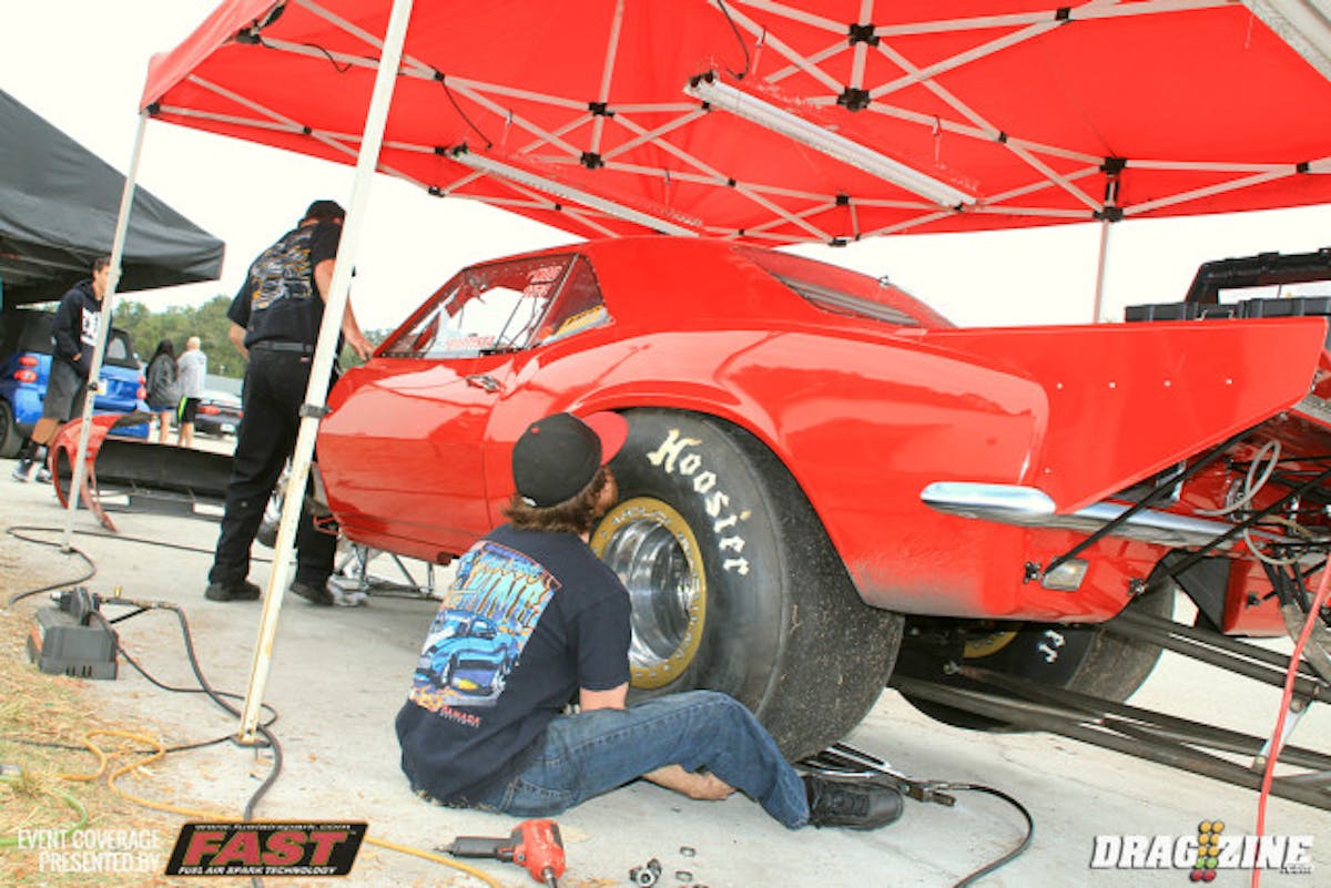 Tim Baptista is out with a new twin turbo combo after campaigning the car with blown alcohol engine and has been sitting out for just about 5 years. His son Tim Jr. is installing new tires on the car this morning. The turbo piping was done at Jason Enos' Victory Racecraft. Jeff Lutz is assisting with dialing in the tuneup.