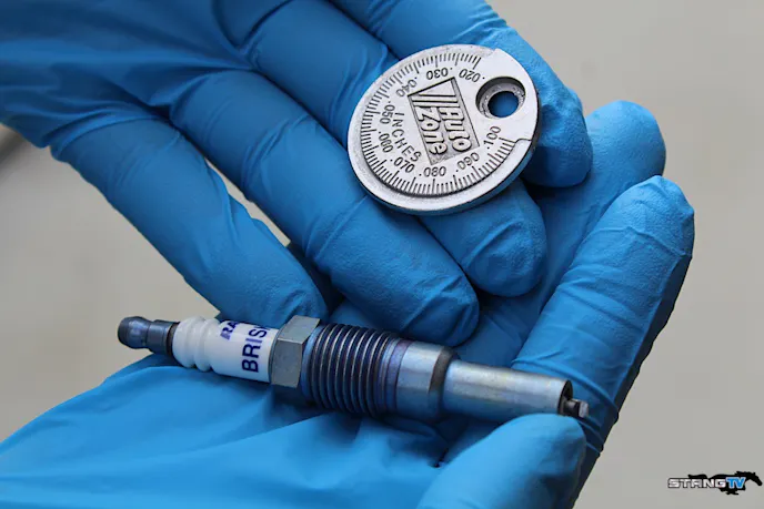 Luckily for us, our new Brisk Racing silver spark plugs are easy to gap thanks to a traditional electrode style. We gapped our plugs to .35 per Vortech and Brenspeed's recommendation for our soon-to-be supercharged 3-Valve.