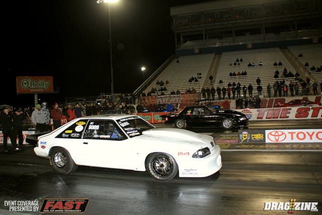 The Magnafuel XDR  final round had Norman Chang and Eric Gustafson with Gustafson having lane choice by virtue of his 4.343 at 167.84 in the semi finals on a single. Chang had the potential as he scored a 4.366 at 167 against James Lawrence who jumped the beam in round three ending his weekend. Chang left first with a .066 light to Gustafson's .089. Gustafson was on a pass for sure but the car power wheelied and hit hard on the center line as he lifted. The cars nearly collided with Chang earning the win with a 4.89 at 129 and both drivers pulling avoidance maneuvers down track.