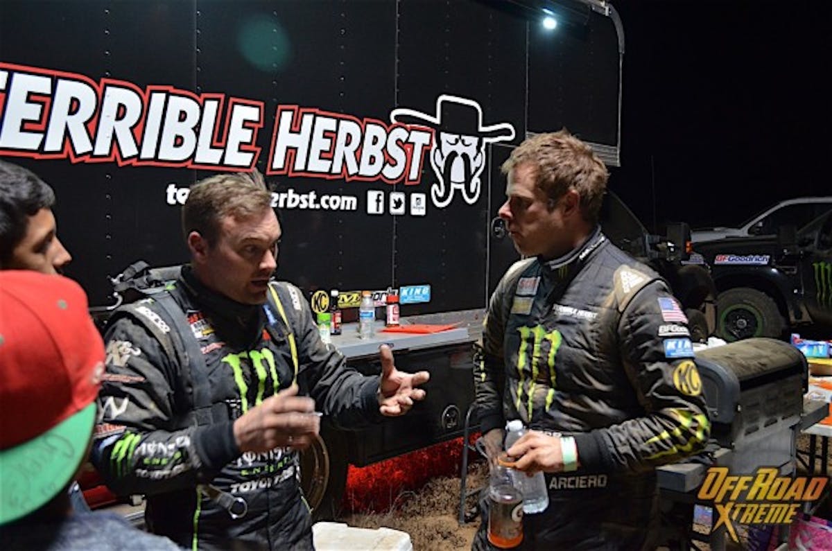 Kyle LeDuc (left) talking with Ryan Arciero (right) after they both got out of the race trucks around race mile 475.
