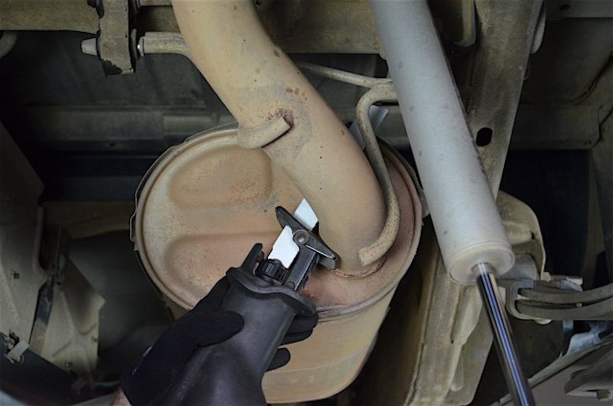 Out with the old. Cut the tailpipe from the back of the muffler to make removal much easier.
