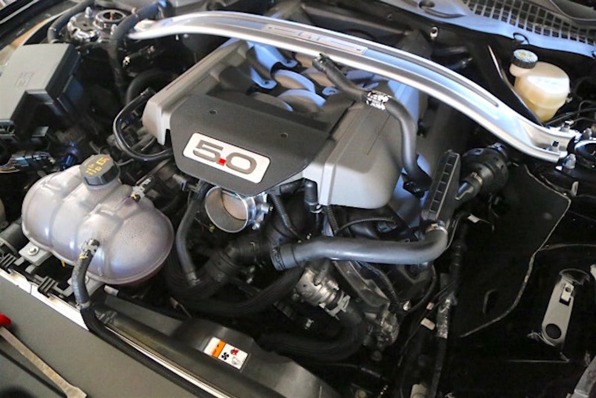 With the factory system removed, the path is clear to install the JLT cold air intake. This system is built for the factory 80mm throttle body, but it can accept a larger unit by way of new silicone coupler.