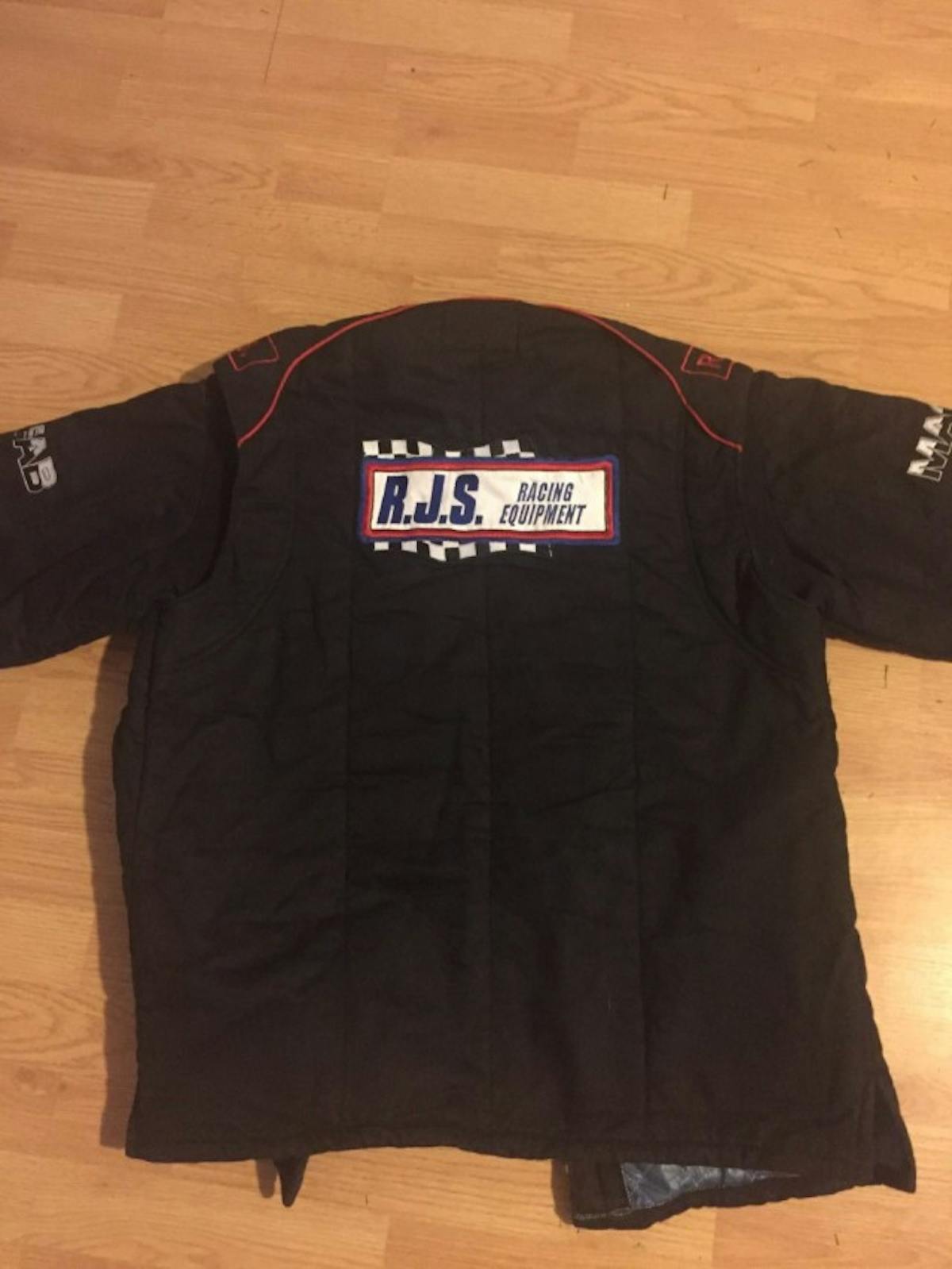 Lyle's new custom racing suit from RJS, including his name and sponsor badges like MacFab Beadlocks and Customs By Bigun.