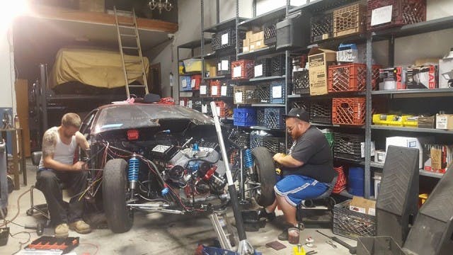 The thrash began with lowering Petey's tried and true cast intake, single carbureted Extreme Racing Engines SB2 engine under the lightweight Camaro body.