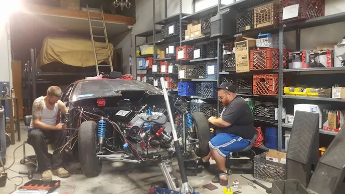 The thrash began with lowering Petey's tried and true cast intake, single carbureted Extreme Racing Engines SB2 engine under the lightweight Camaro body.