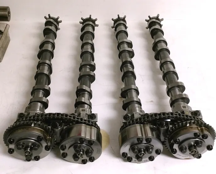 The Voodoo 5.2-liter features a different firing order than its cousin the Coyote thanks to its Flat-Plane Crankshaft. That means its cams are unique to the Voodoo engine. John removed them to swap springs, but John says the factory grinds are great for all-around performance, so they stayed in the engine. (Photo Credit: Hellion)