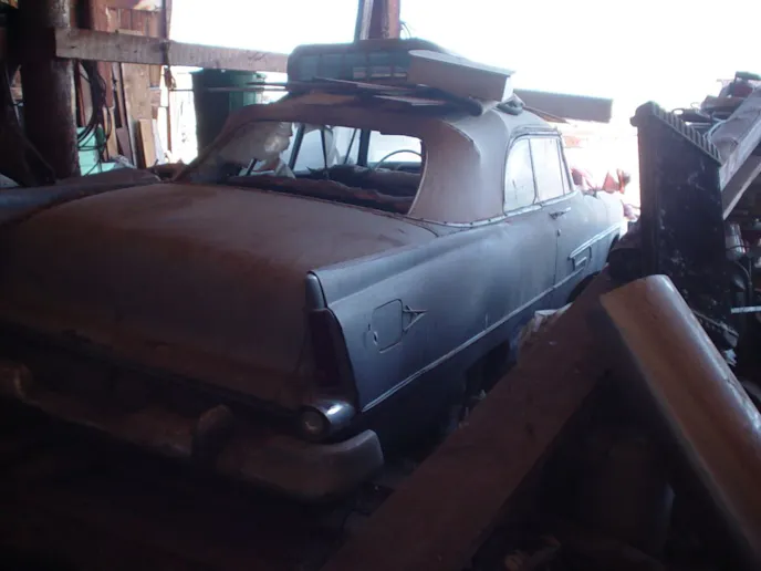 Having maneuvered around the junk in the sawmill shed, Stan was amazed at how good the body appeared. Now if only the rust hasn’t attacked it too badly! Best part: The canvas top is intact!