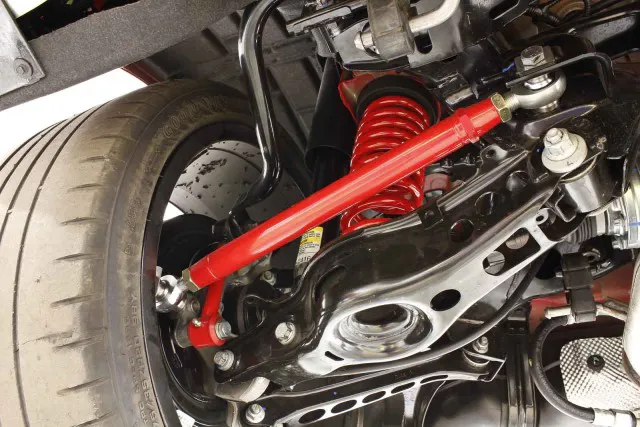 The toe rods bolt up with high-quality, Teflon-lined rod ends. These eliminate bushing deflection, keeping the rear toe setting consistent during aggressive maneuvers and went big power is applied.