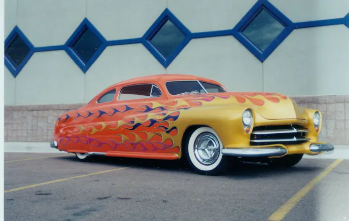 The Merc in its former glory. Tangelo Orange with flames.
