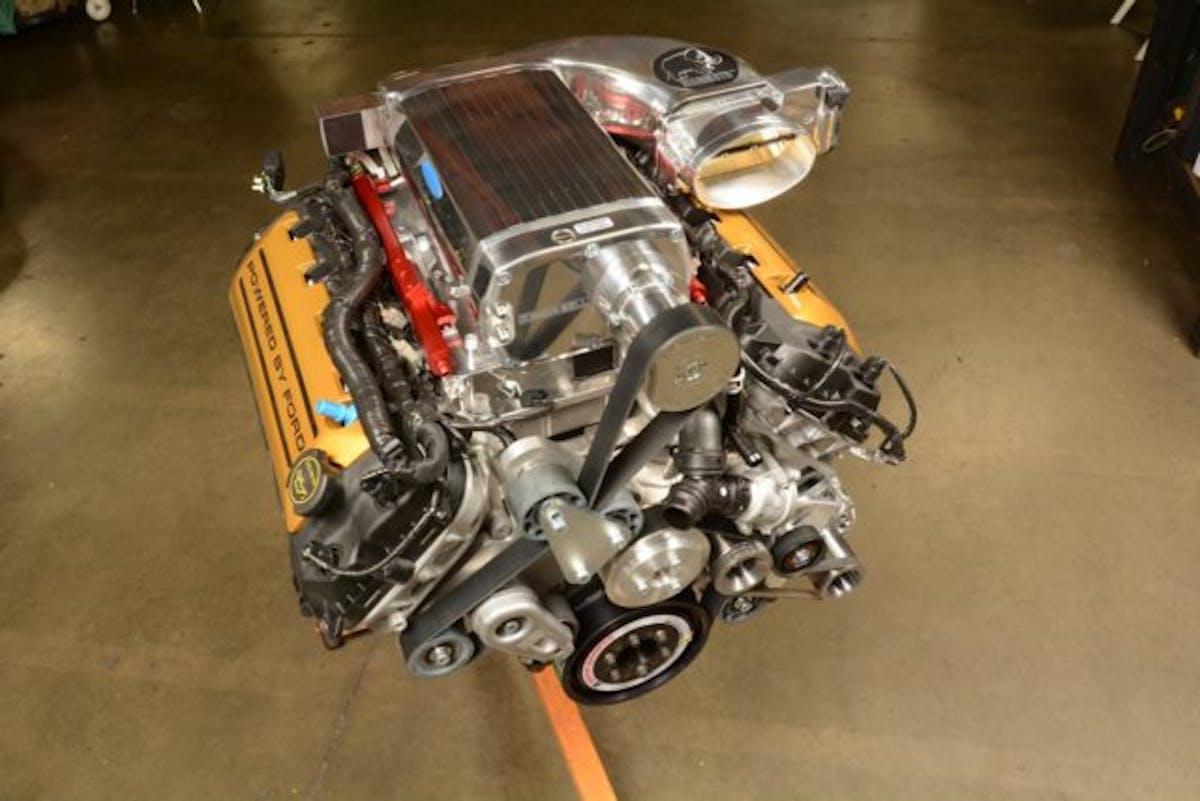 Destined for a special Hurst-Kenne Bell Mustang, the 1100 hp engine was already wearing its distinctive gold coil covers when the 10-rib blower drive was mocked up. 