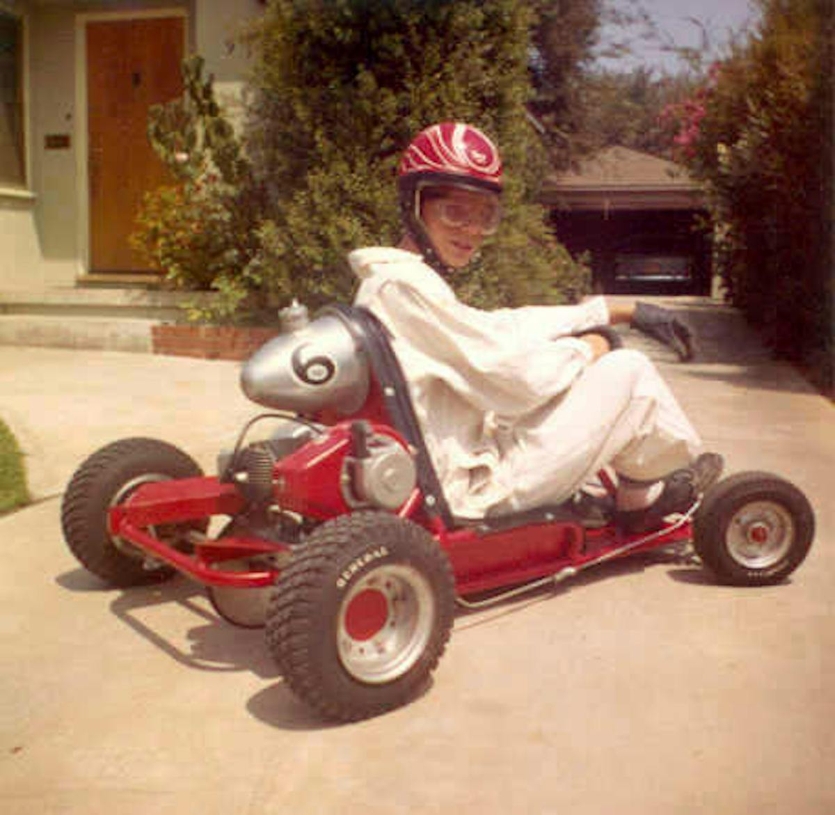 Kenny's first pinstripe job on the helmet and lettering job on his Go-Kart and the family’s ’55 Chevy in the garage.