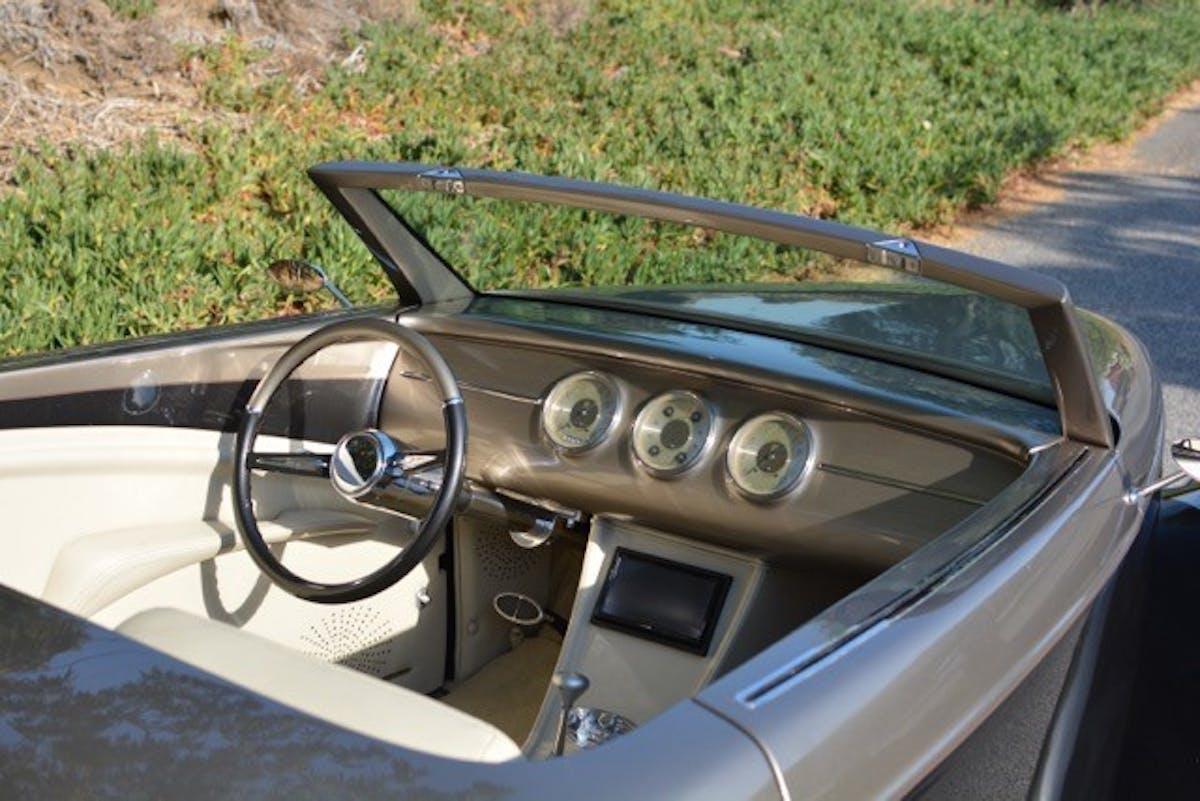 The interior of Venom was completely redone. The dash was modified and fitted with Classic Instrument gauges, the seats were