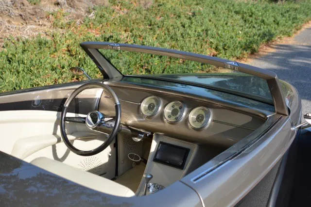 The interior of Venom was completely redone. The dash was modified and fitted with Classic Instrument gauges, the seats were