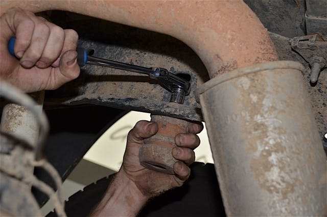 The factory bumpstop is a simple removal, a single bolt on each unit will release it from the frame.