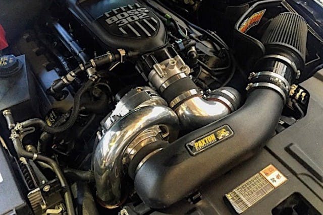 The Coyote in question wears its Paxton Novi 2200 supercharger front and center, to the passenger side of the engine bay. Earlier iterations for the 4.6-liter three-valve are mounted on the driver's side.