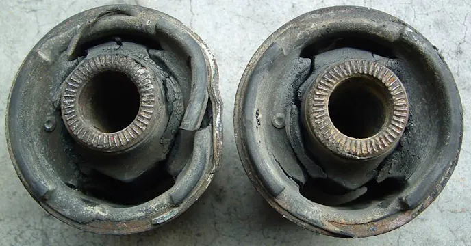 These two bushings are from a third-generation Lexus SC300, but they show what happens over time to rubber bushings. These ones have lasted 55,000 miles before being replaced.