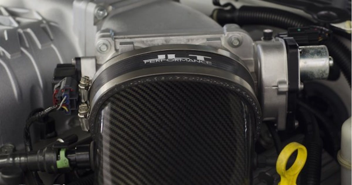 Here’s a look at the stock inlet and throttle body on a Trinity TVS. If you have been around aftermarket positive-displacement blowers, you know that they often have much larger inlets as restrictions on the intake side definitely hurt power and efficiency. A JLT Super Big Air intake will also help reduce restriction.