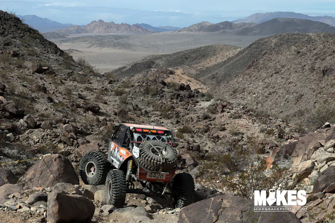 A new trail for 2017 was Full of Hate. High up on the mountain above claw hammer, you can see Upper Big Johnson in the background. Jeremy Schneider is seen here picking his way through the boulders.