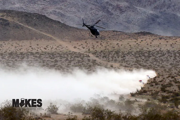 With only a few miles to go on lap three, Shannon Campbell is in hot pursuit of his Son Wayland just ahead. They are both about to blow past #725 Chris May who has no idea what is about to descend upon him.
