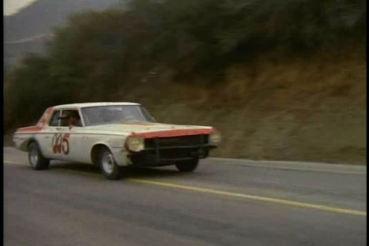 A race-prepped 1964 Dodge 330 in pursuit.