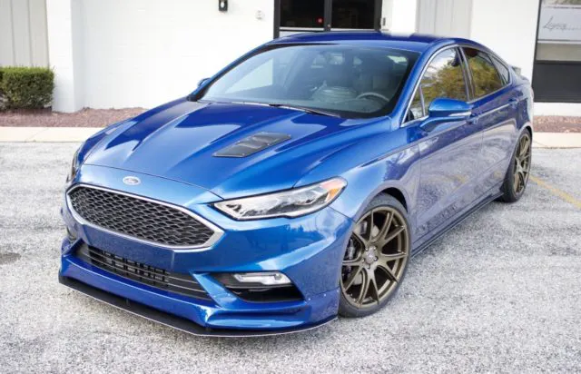 Sprayed in a fetching BASF R-M series Legacy Bay Effect hue, the Legacy Innovations Fusion Sport wears body bits from Driven by Style, Extreme Dimensions and Legacy Innovations. (Photo Credit: Legacy Innovations)