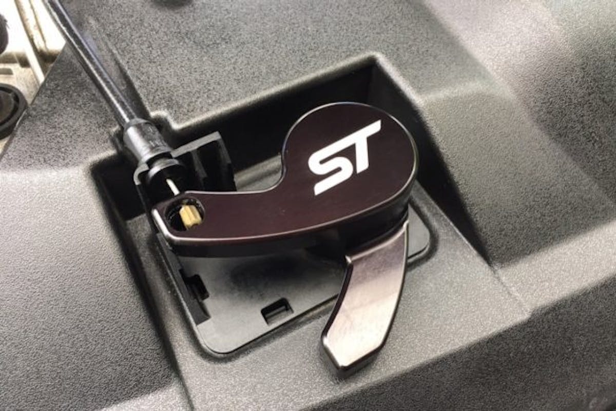 Here is the finished installation of the Steeda Focus ST Hood Latch Release Lever (PN 555-0690; $64.95). It looks so great under the hood we had to clean up the engine compartment a bit to showcase it.