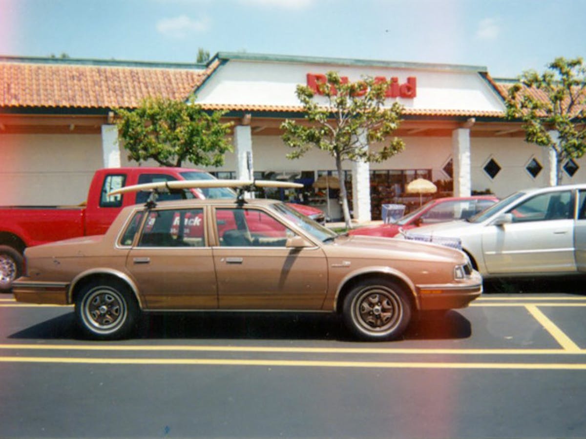 Does it make sense to tax owners of older vehicles, like this Oldsmobile surfboard hauler more just because it is old? A proposed bill (HB2877) would have charged owners of 20-year-old vehicles $1000 every five-years.