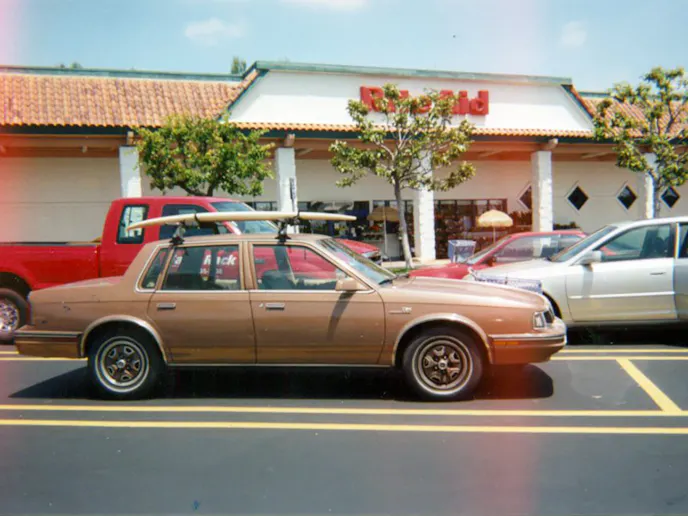 Does it make sense to tax owners of older vehicles, like this Oldsmobile surfboard hauler more just because it is old? A proposed bill (HB2877) would have charged owners of 20-year-old vehicles $1000 every five-years.