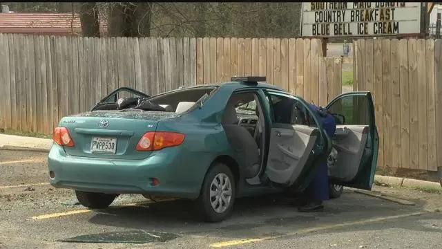 Barbara Harlon's car after the stolen Toyota Tacoma landed on it.