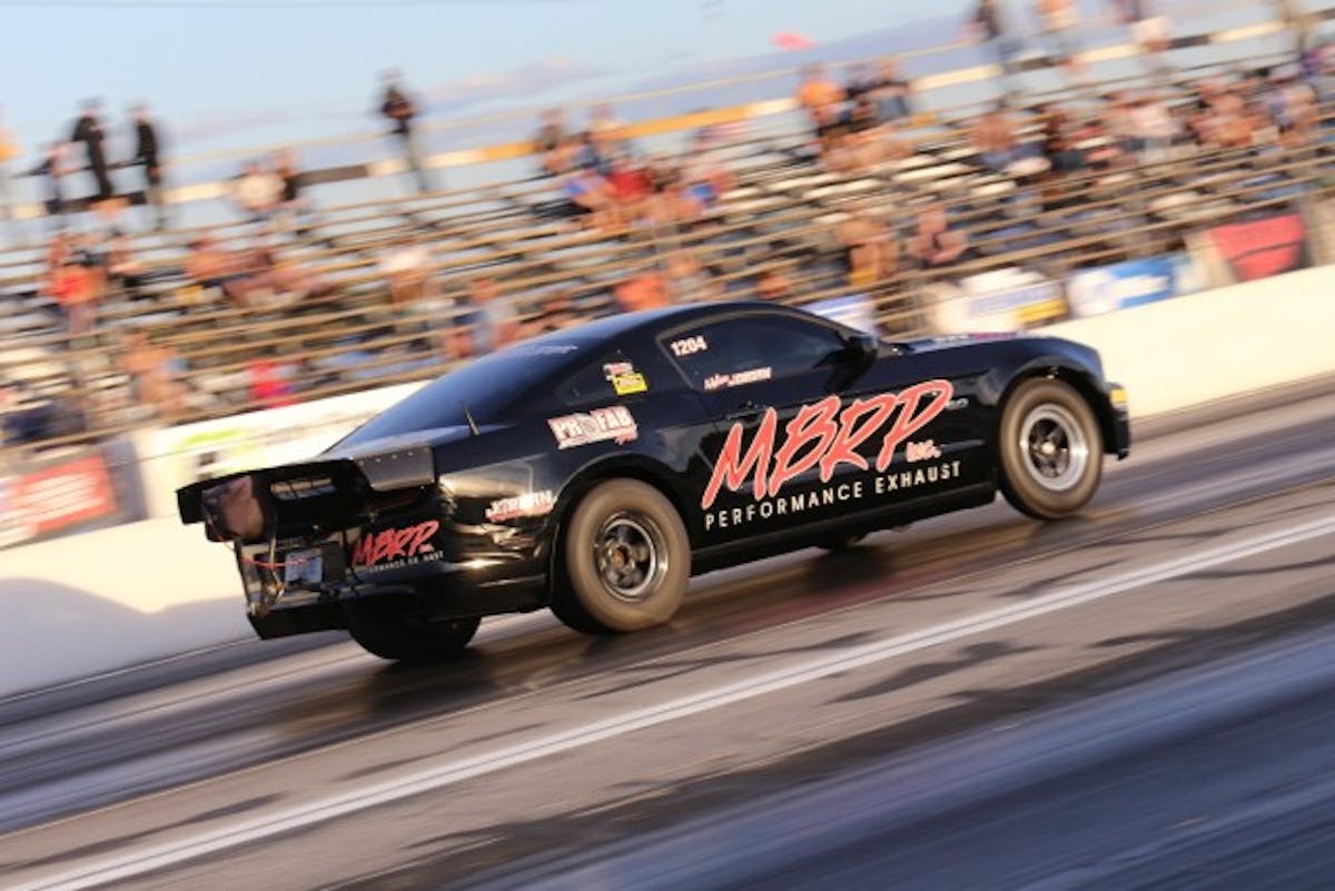 After working 44 hours straight with no sleep to revamp his ride for the event, Justin Jordan showed up today and put his Hellion Turbo-boosted Mustang right to the top of the Turbo Coyote Shootout qualifying sheet with a 7.89 at 181 mph rip.