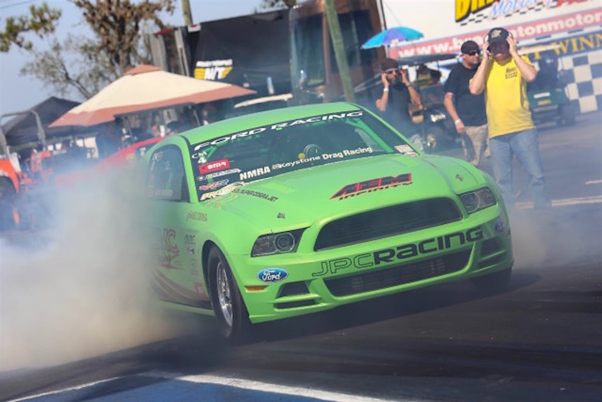 John Kauderer blasted off the quickest pass in Coyote Modified history to claim the top qualified spot with a clean 7.74 at 174.96 rip.