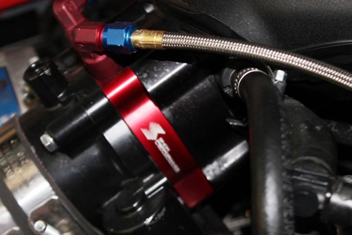 Also included in the Stage 2 system is this throttle body spacer plate, which allows easily plumbing one or two water-meth nozzles into the air stream without any drilling or custom work.