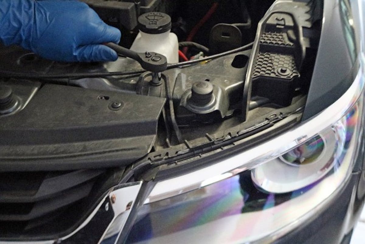 There are two bolts that secure the top of the light to the