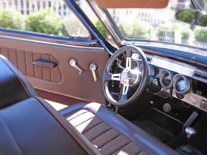 The interior was custom made for this car. Autometer gauges were grafted into the original bezels to keep the original styling.