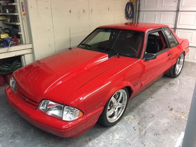 Riding low on Boze forged wheels and Nitto tires, you might assume this is just a clean Fox coupe. However, under its House of Kolor red exterior hides a potent drivetrain ready for street or strip.