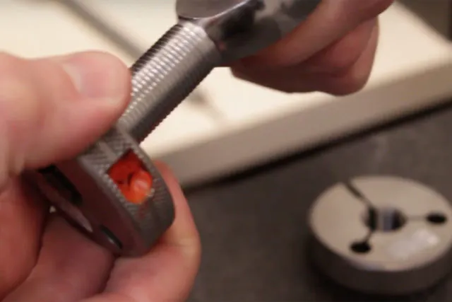 A simple "go" or "no-go" test is performed by screwing the rod end into a threaded tester. This identifies if the thread pitch is within specification.