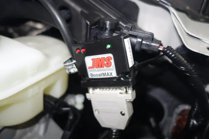 You can mount the BoostMax anywhere in the engine compartment, but for the purposes of showing for our cameras, Rick mounted it in plain sight. You could hide it so people think it’s still stock. 