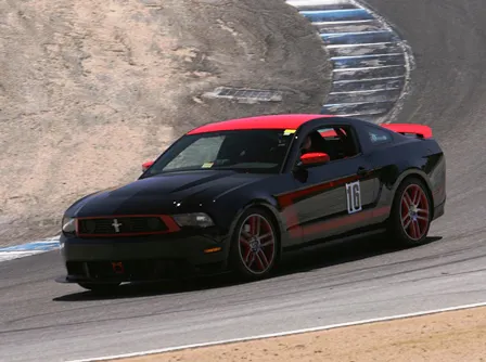Johnson navigates his 2012 Boss 302 at Laguna Seca raceway.