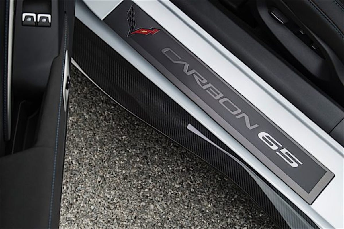 Exclusive Carbon 65 sill plates greet driver and passenger.