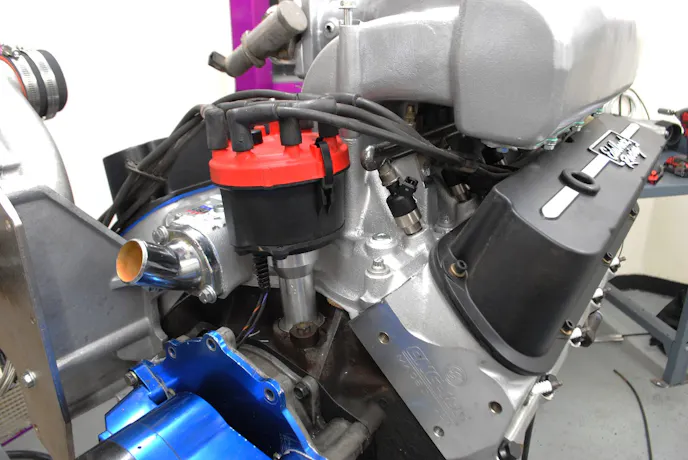 This MSD billet distributor and matching plug wires handled the ignition chores. Spark energy is doubly important on a supercharged application.