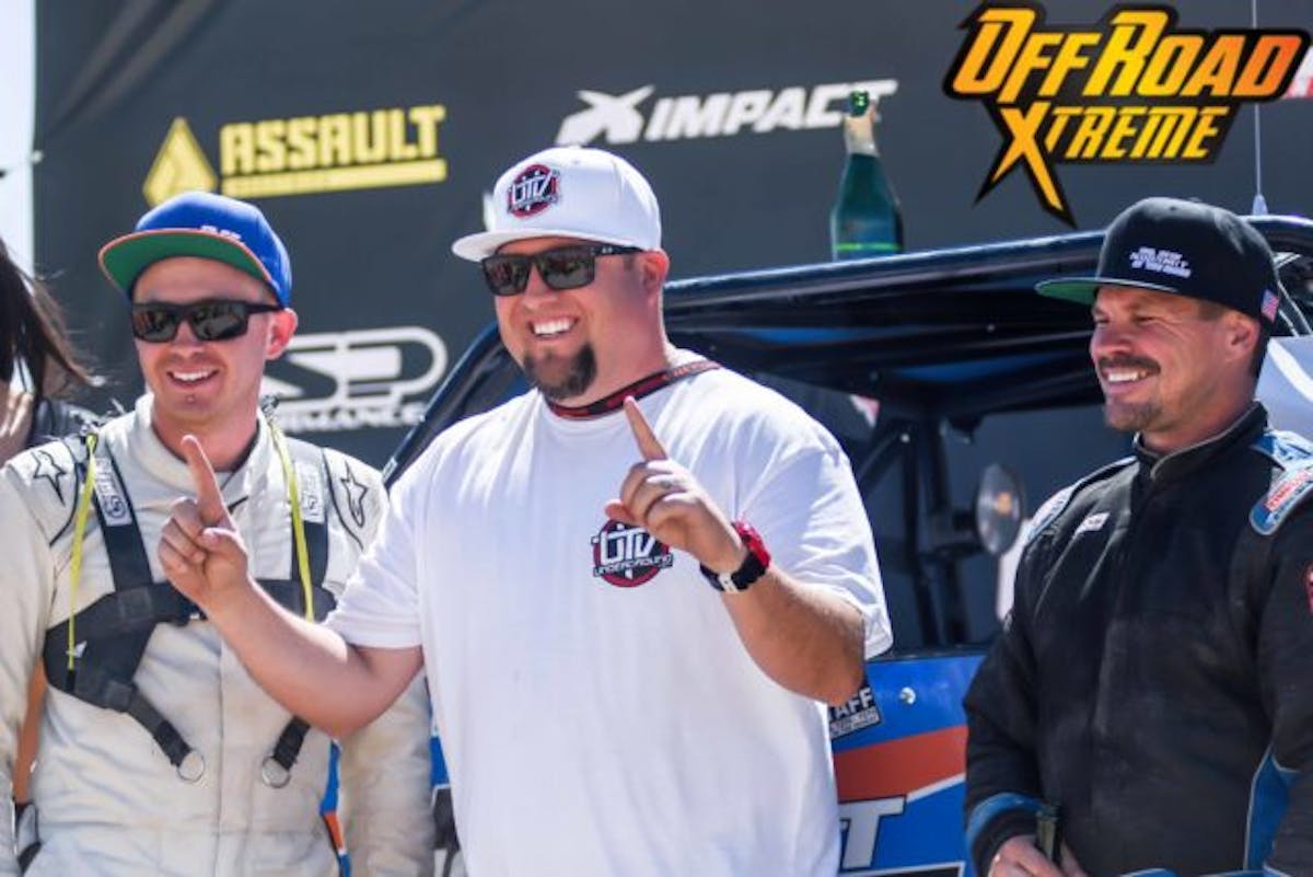 Joey D. of UTV Underground greets World Champ Blurton on the podium.