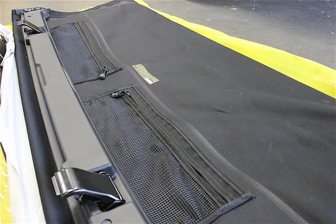 Zippered mesh pockets help the driver and front passenger store little items, adding to the utility of the Trektop NX Glide.