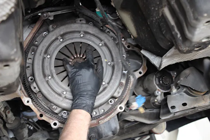 Removing the worn-out, factory clutch assembly.