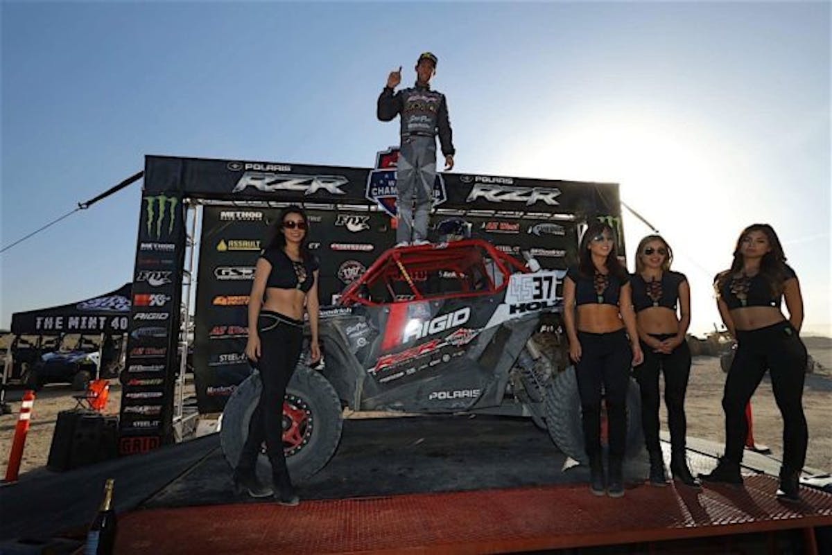 RJ Anderson atop is Polaris RZR after taking home the win in the short-course race.