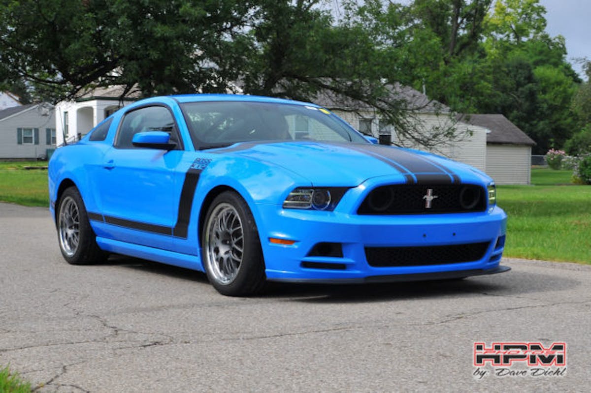 Wright's Boss 302 might look relatively stock from the outside, but underneath the skin is a track-honed machine with JRI coilovers, Steeda chassis bits, and the high-wnding 5.2-liter motor you'd normally find under the hood of the new GT350.