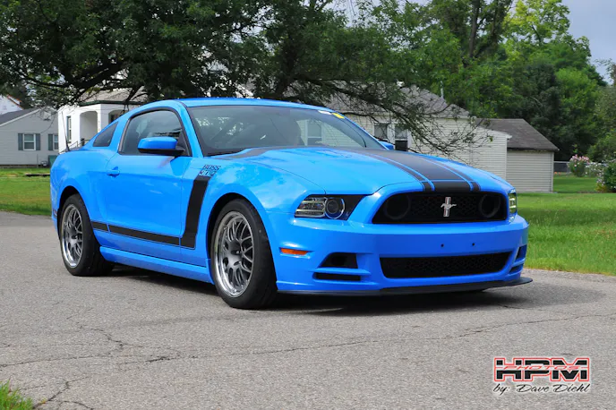 Wright's Boss 302 might look relatively stock from the outside, but underneath the skin is a track-honed machine with JRI coilovers, Steeda chassis bits, and the high-wnding 5.2-liter motor you'd normally find under the hood of the new GT350. 