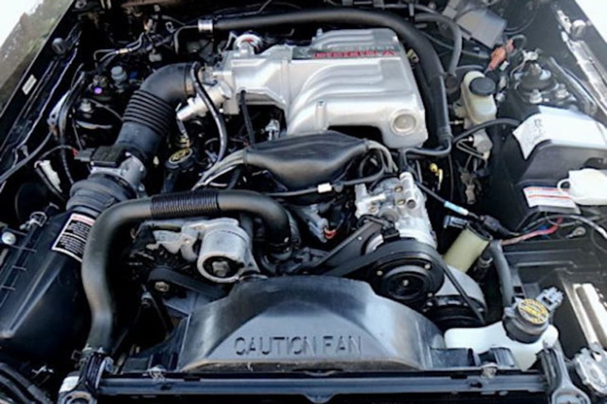 While the bottom end of the Cobra's V8 was identical to the GT's powerplant aside from the camshaft, the top end saw significant changes that bumped overall output up by 30 horsepower and 5 pound-feet of torque versus the standard 5.0. (Photo Credit: Bring A Trailer)